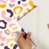 0065313 multi purple leopard spots peel and stick wallpaper.jpeg