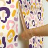 0065316 multi purple leopard spots peel and stick wallpaper.jpeg