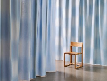 Rey curtain fabric in situ room shot with chair anchor