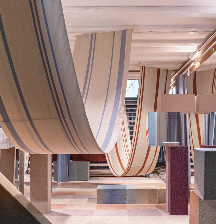 Interior hung with long draped panels of striped fabric
