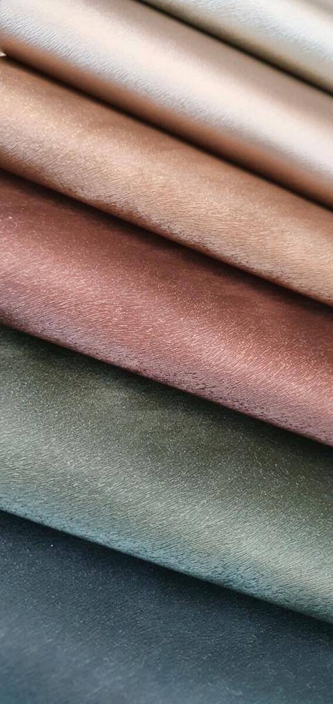 Rolled samples of Peloso in jewel tones