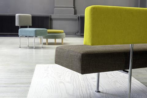Yellow and brown upholstered benches in an office