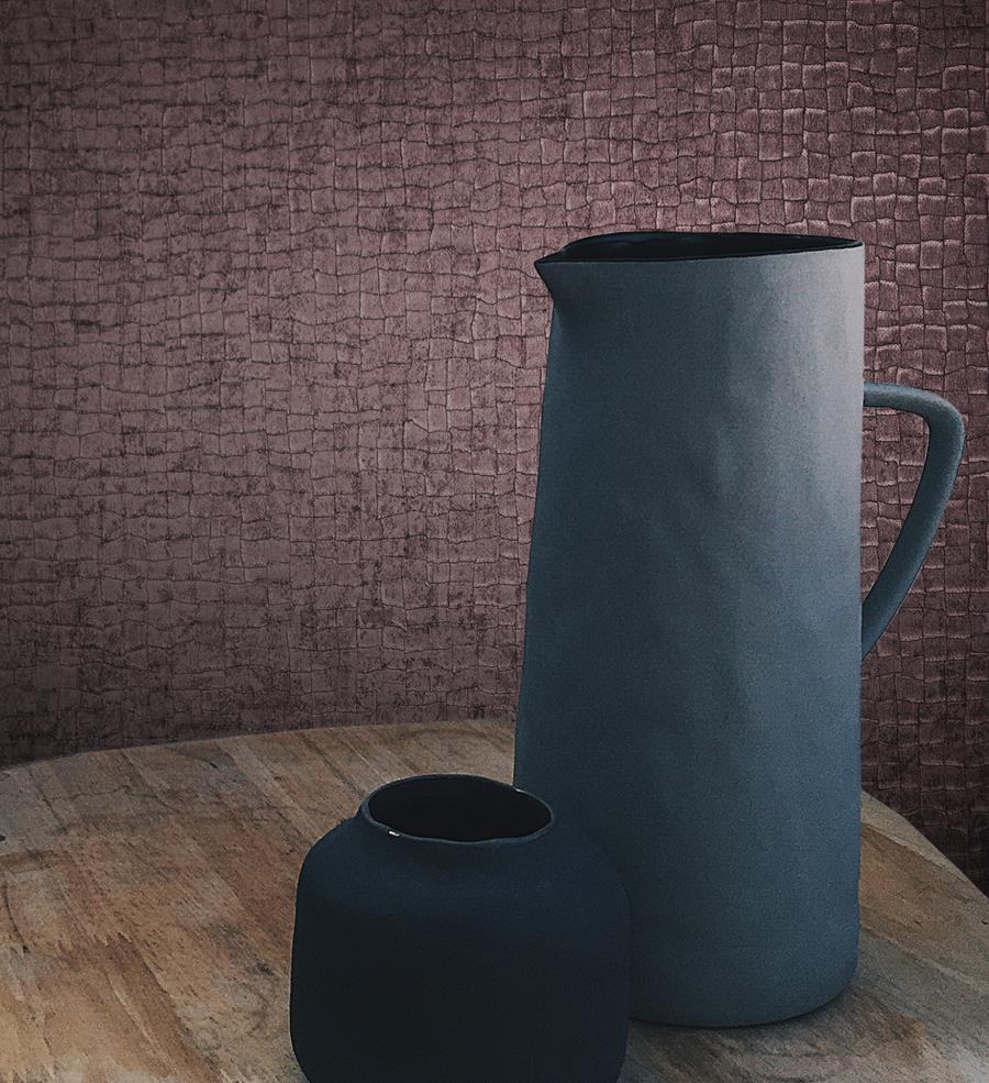 Dark blue jug and vases against a burgundy textured Newmor Acacia wallcovering