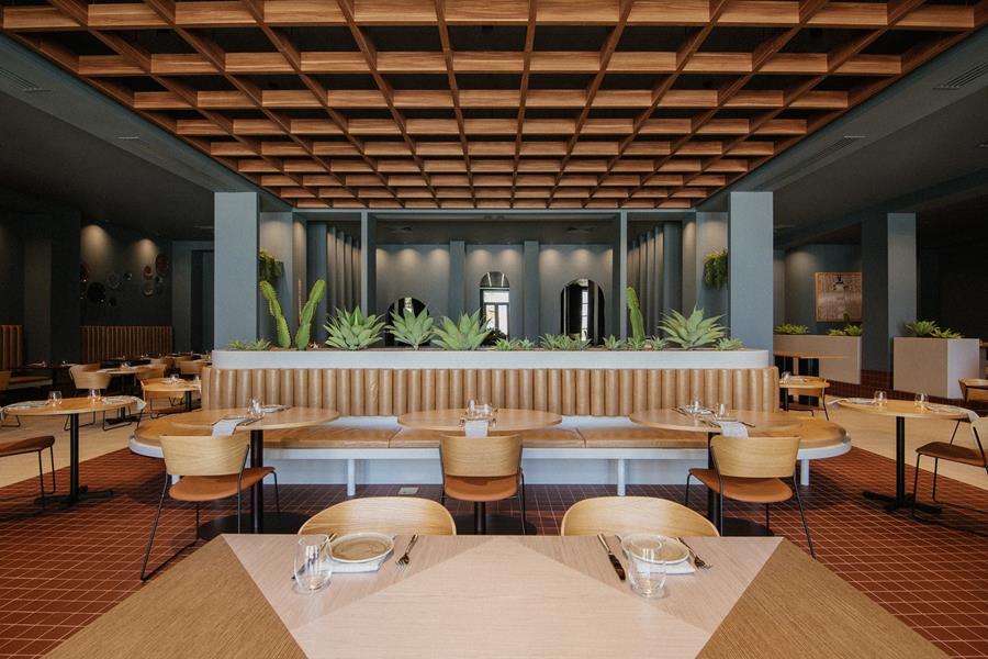 A hotel lounge with tan leather seating