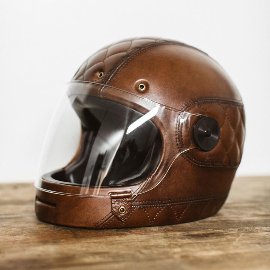 A motorcycle helmet covered in brown leather
