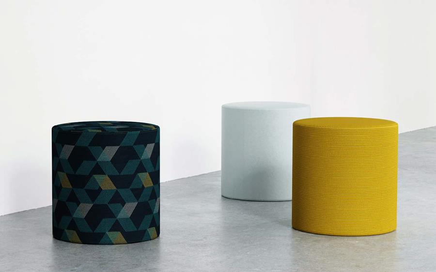 Round ottomans in navy pattern and yellow corduroy