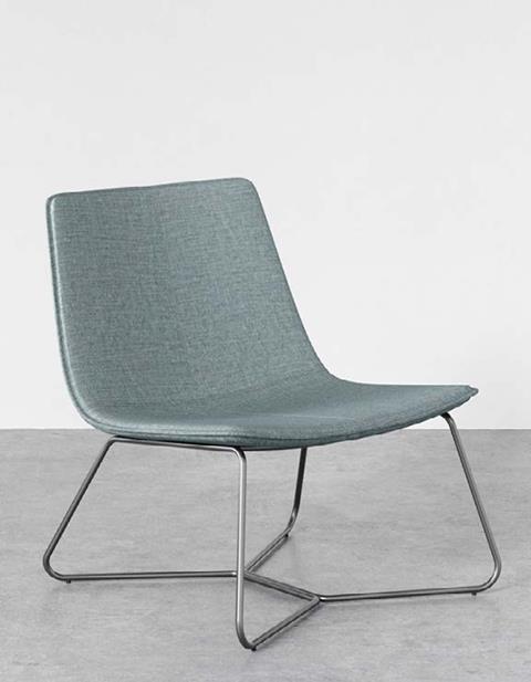 A sage upholstered lounge chair on a sled base