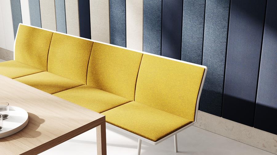 Yellow upholstered sofas in an office lounge