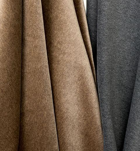 Draped Designtex fabrics in tan and grey
