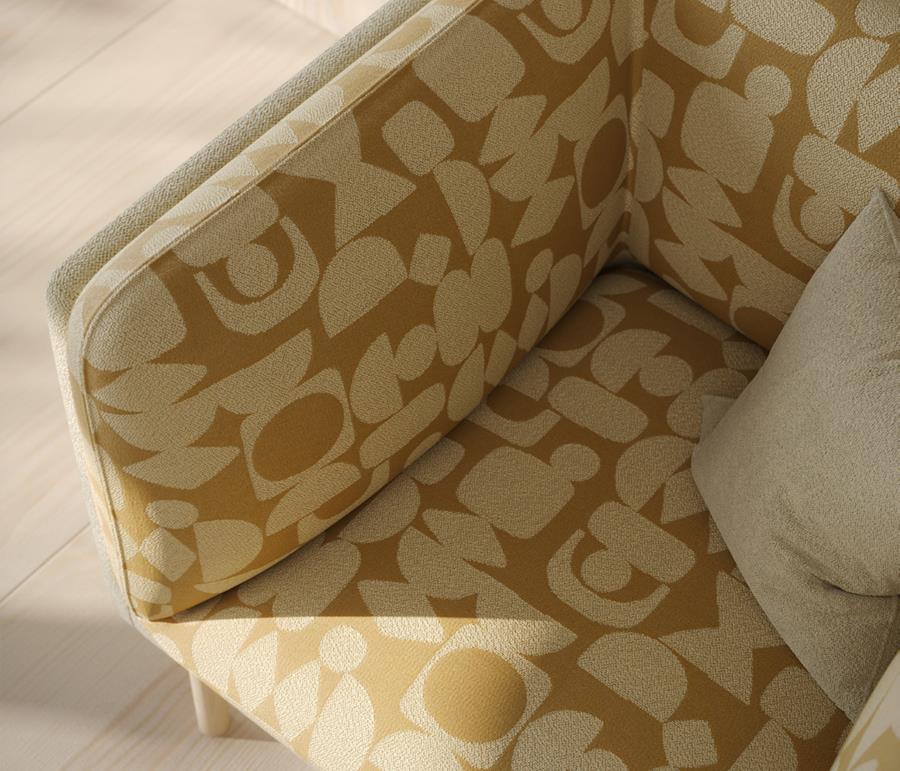 A chair in a mustard abstract-pattern fabric