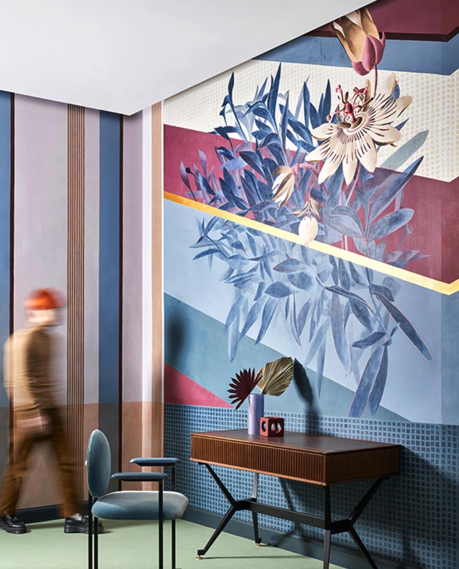 Misha Esotismi Passiflora: large blue and pink flowers painted across a study wall