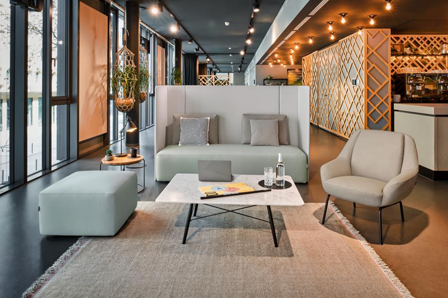Lounge with a grey skai sofa and armchairs