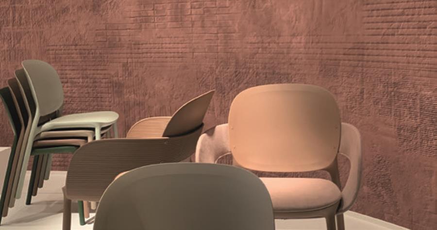 A restaurant with skai Evida Fiber chairs against a terracotta wall