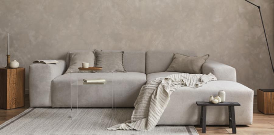 A living room with a grey sofa in skai Evida Fiber