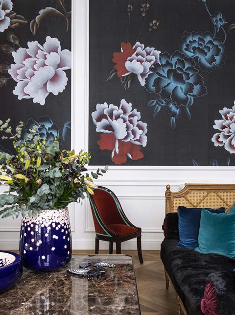 Misha Floating Peonies: white and blue peonies on dark panels in a sitting room