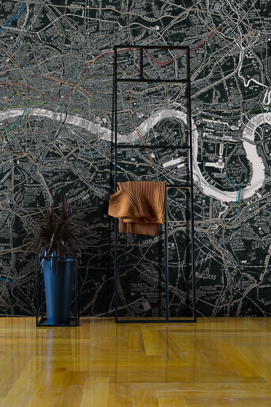 Stephen Walter London Subterranea: a black and white map mural behind a chair