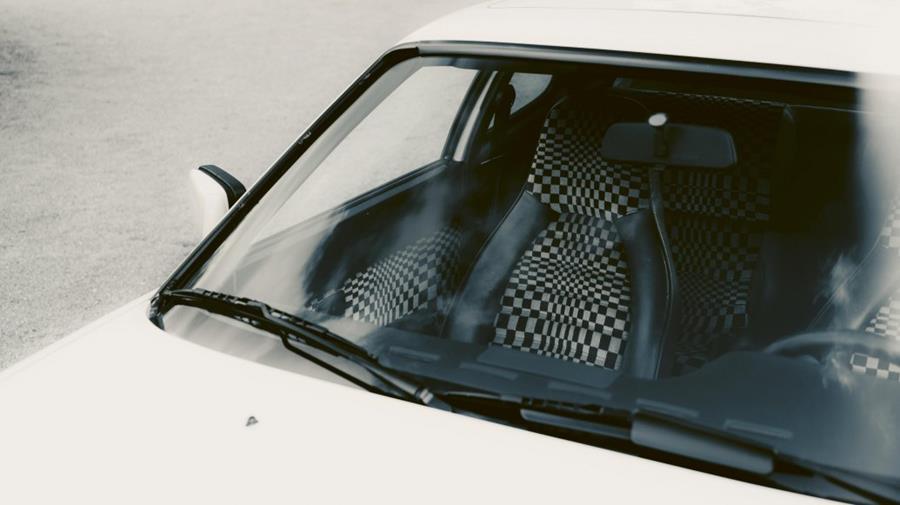 Classic car interior with pepita check seats