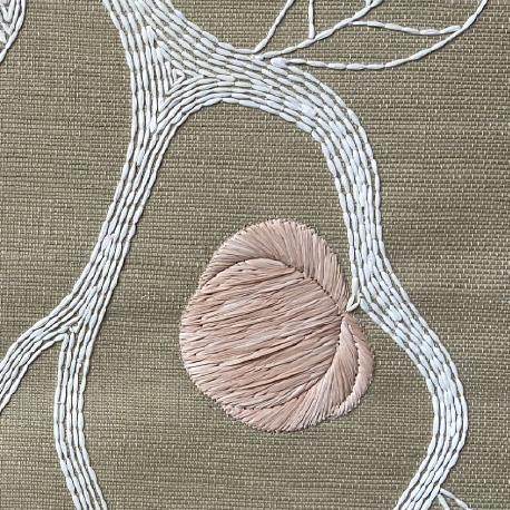 Close-up of a pear embroidered on raffia