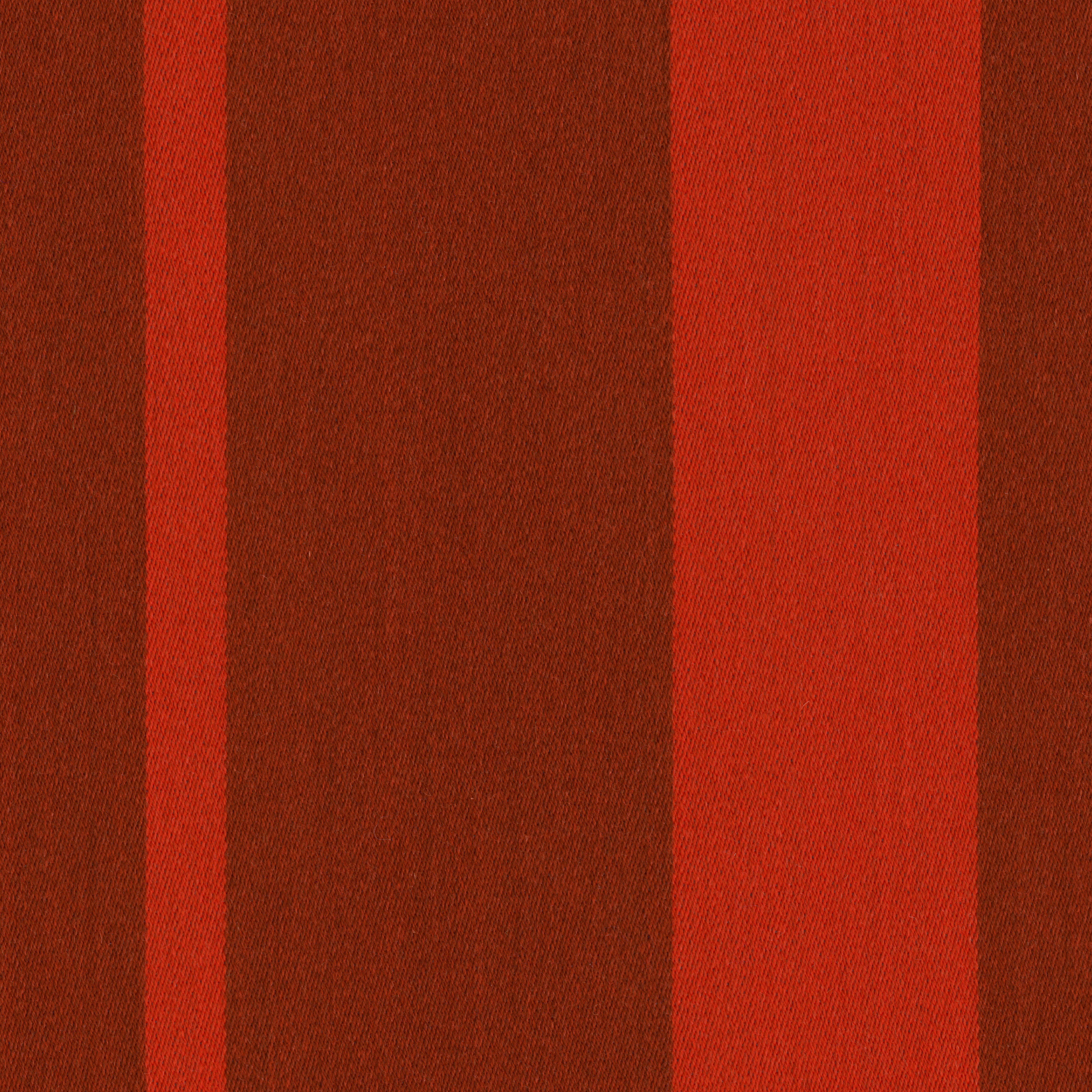 Red and rust striped wool fabric, close up