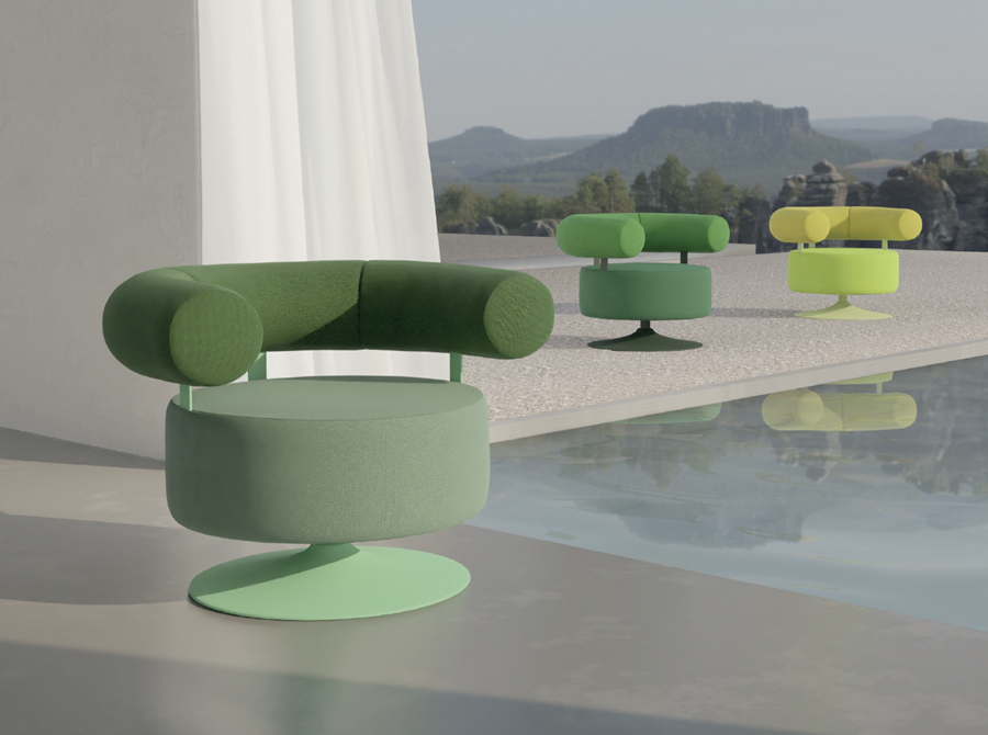 Green upholstered lounge chairs on a terrace beside a reflecting pool