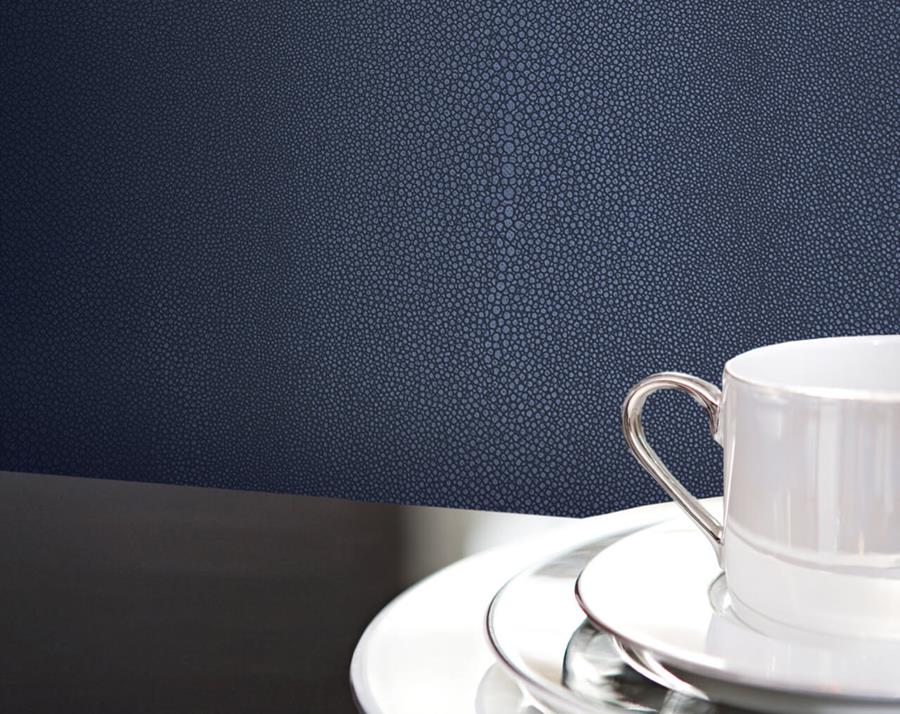 White cup and saucer against navy Newmor Shagreen wallcovering