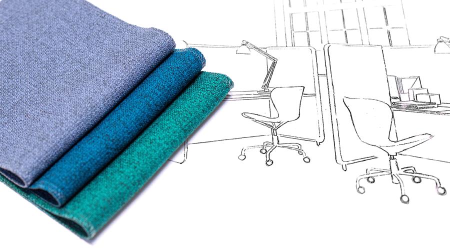 Folded Gabriel fabrics in blue and teal over an office drawing