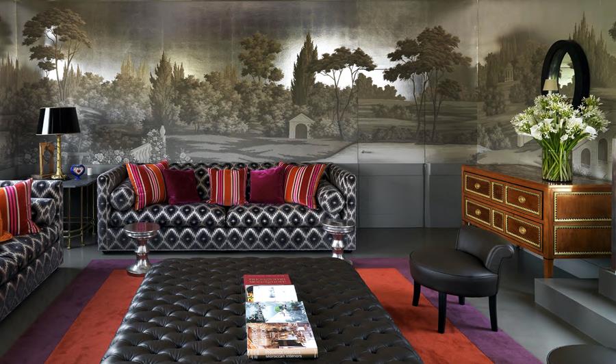 Living room with a misty painted landscape across the wall