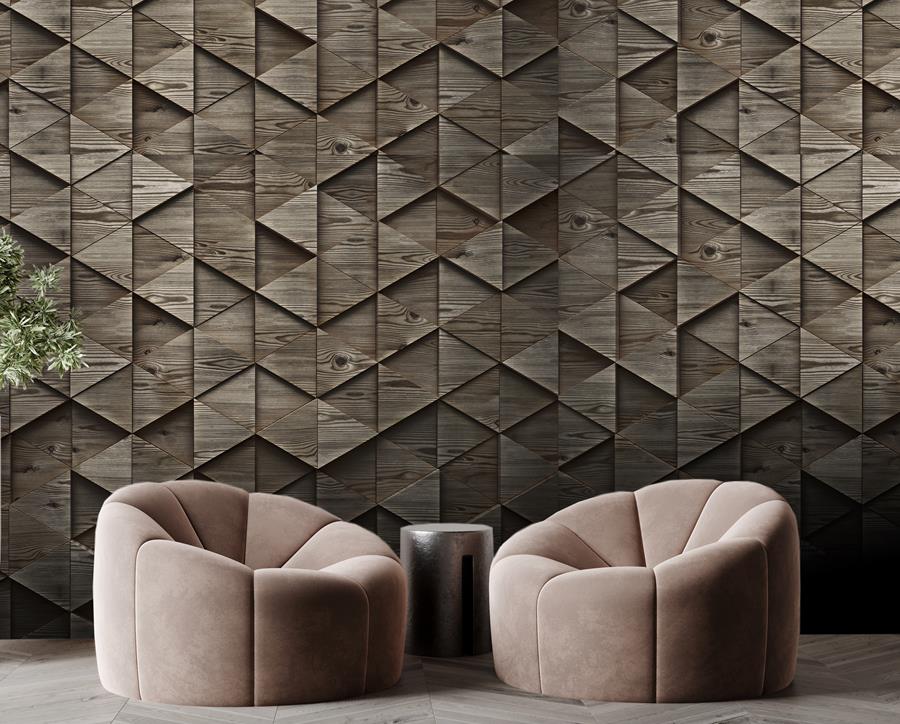 Lounge with a faceted geometric wallcovering in bronze and two rounded armchairs