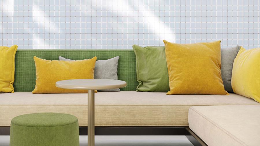 White lounge sofa with green and yellow cushions