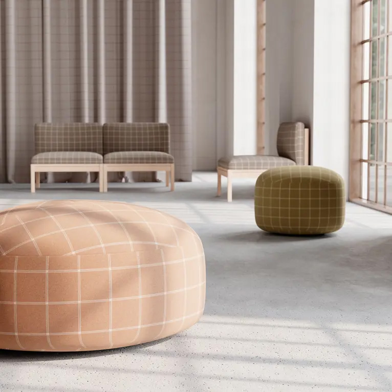 Uptown: a grid-check pouf and bench seating in a pale room