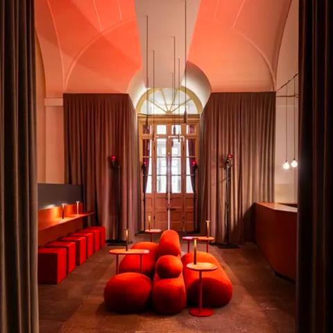 Bar Adrenalina, Milan: orange room with upholstered seating