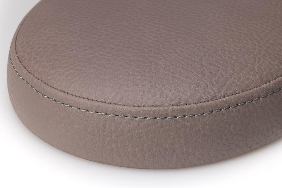 Close-up of a stitched seat cushion in taupe skai vinyl