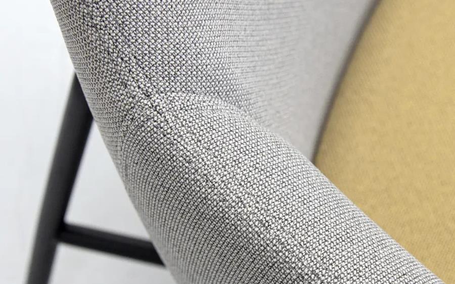 Grey and yellow Cura Loop on a chair, close up