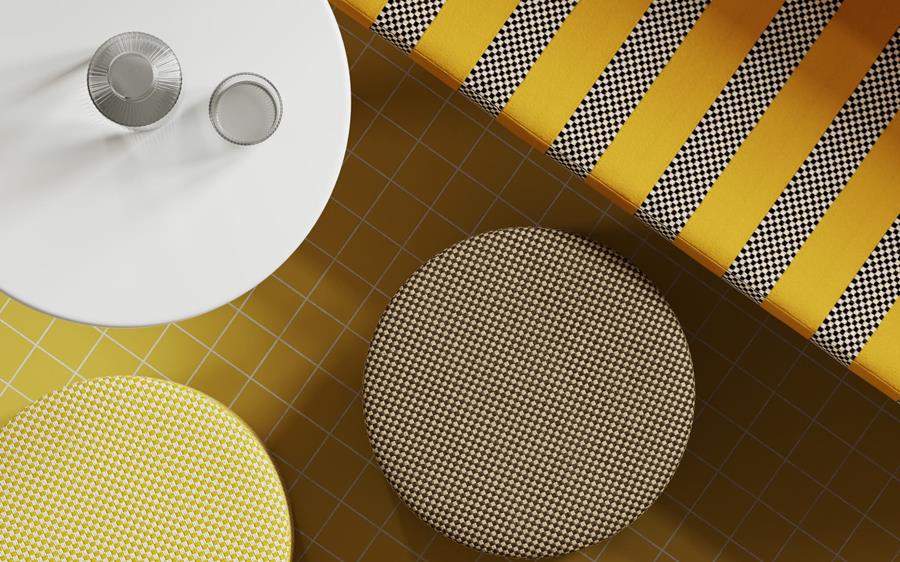 Racetrack: yellow and black striped outdoor fabric beside round stools
