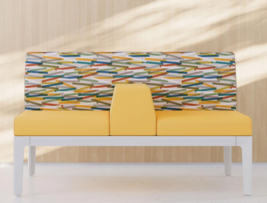 Bench seat in yellow with a multicoloured patterned back