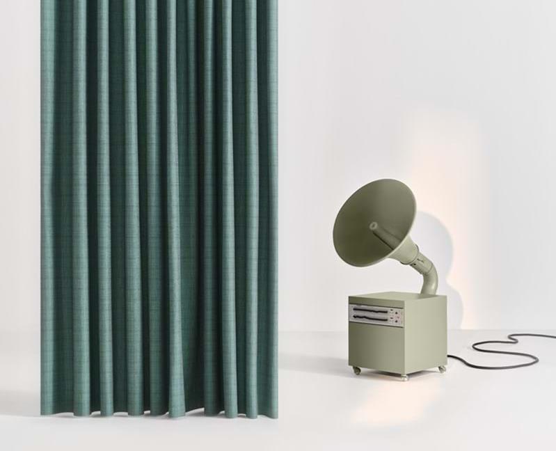 Green Svensson curtain beside a vintage speaker