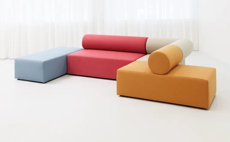 Modular lounge seating in blue, red, cream and ochre fabrics