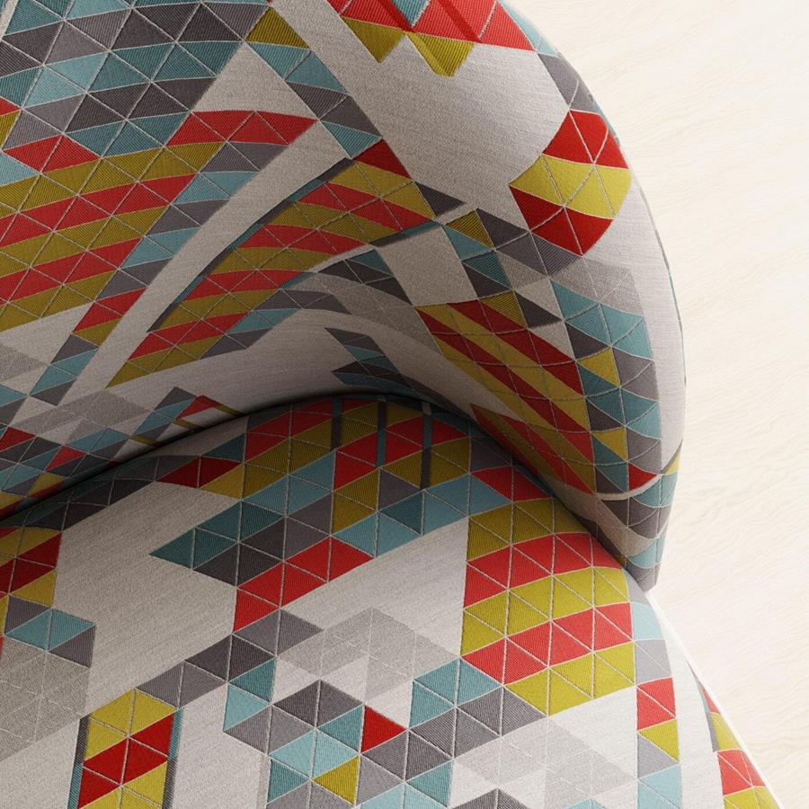 Vertex: upholstered form in a multicoloured triangle pattern