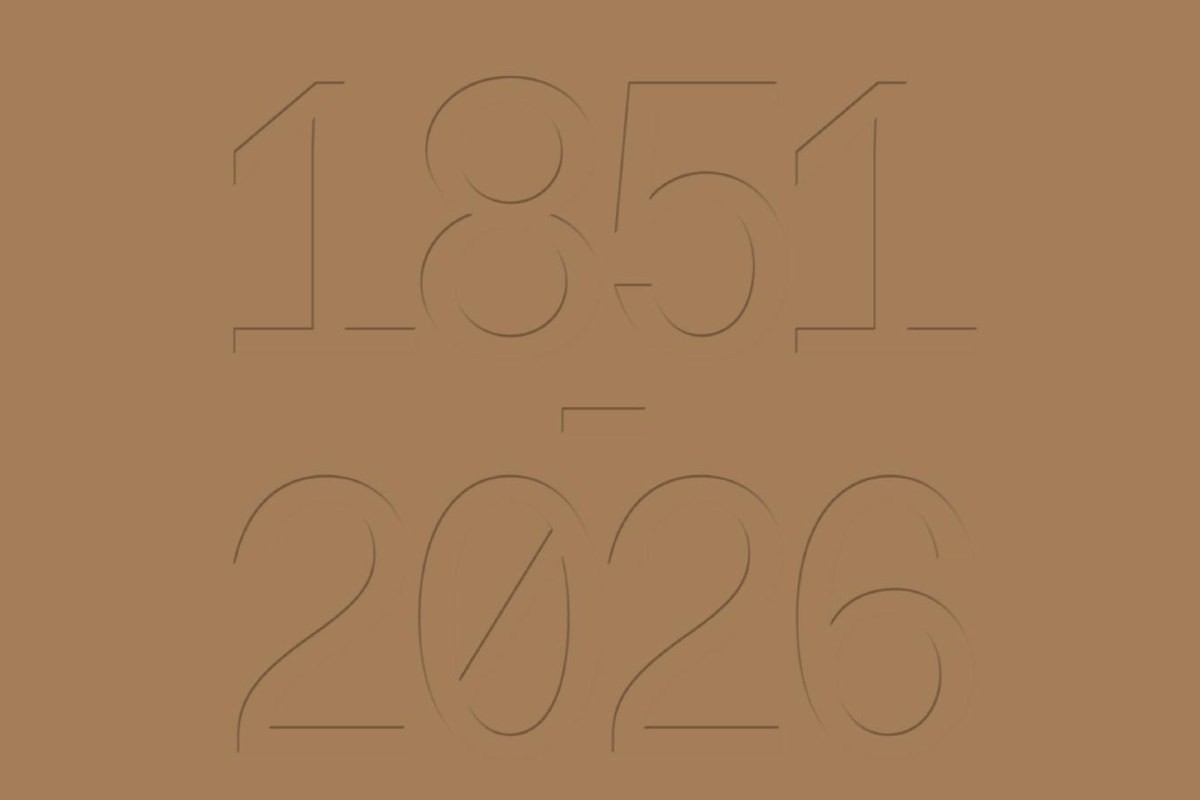 1851 and 2026 embossed on a tan card