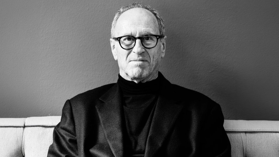 A black and white portrait of Matteo Thun, in glasses and a black jacket