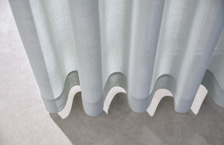 Pale blue sheer curtain with soft wave pleats
