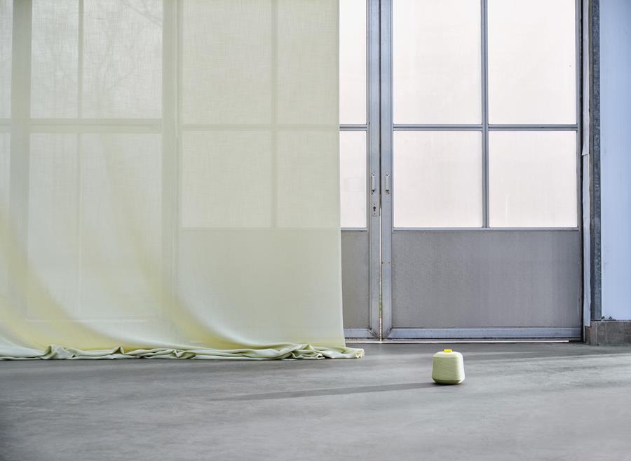 Sand: pale yellow transparent curtains in a light-filled warehouse