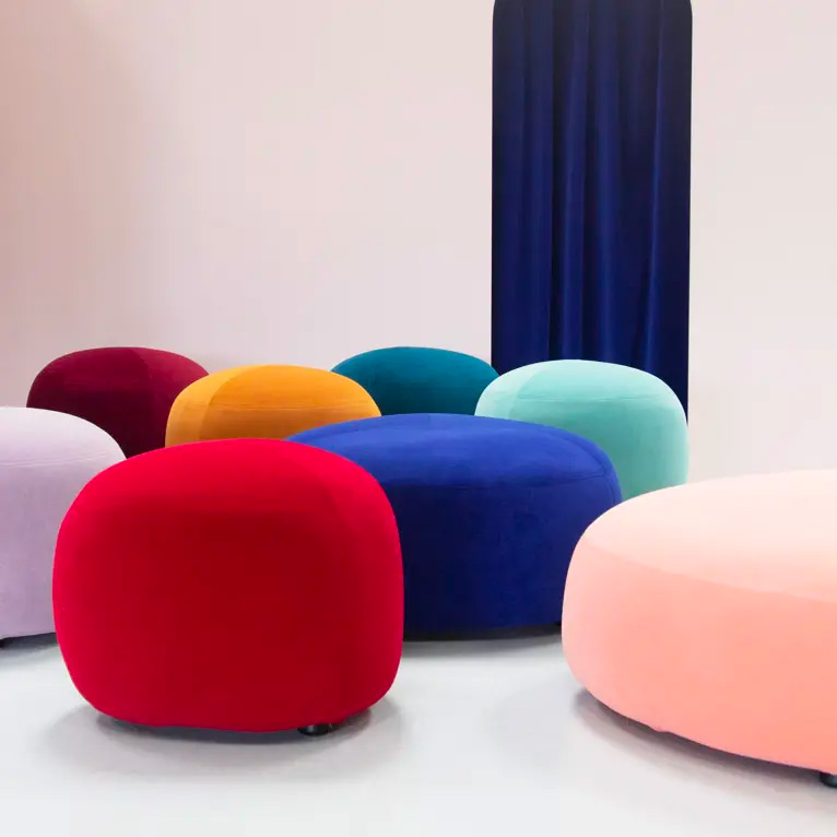 Savoy velvet: round ottomans in red, blue, pink and yellow