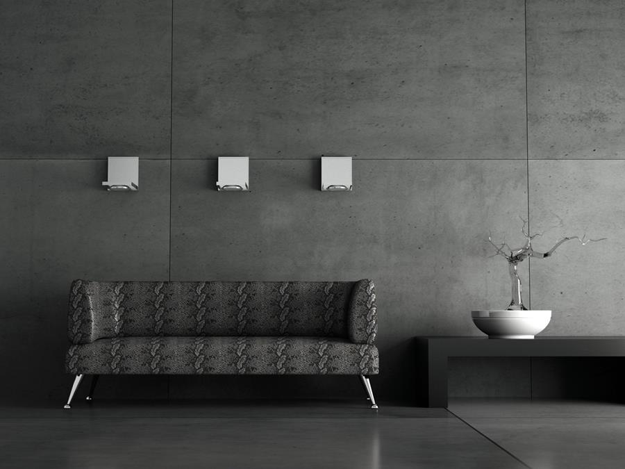 A dark lounge with a black skai sofa