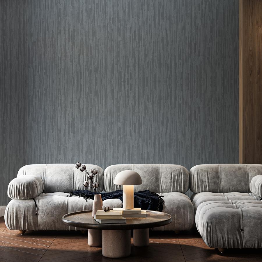 Newmor: lounge with a slate-grey textured wallcovering and modular sofa