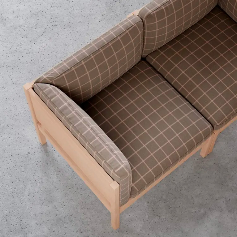 Downtown: an armchair upholstered in a brown grid check