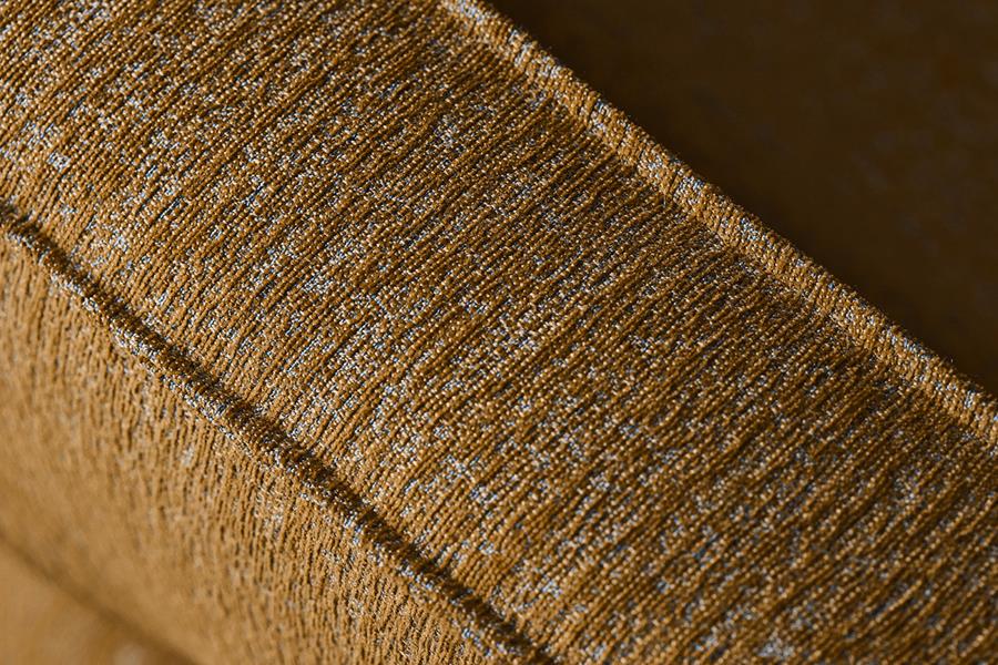 Close-up of gold Svensson Wow Re upholstery fabric